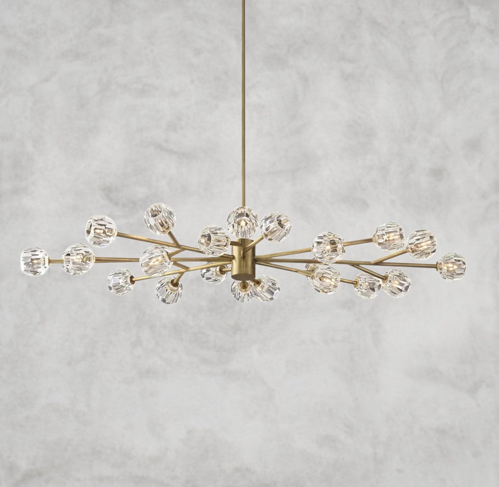 Modern chandelier with gold and crystal design on a gray background